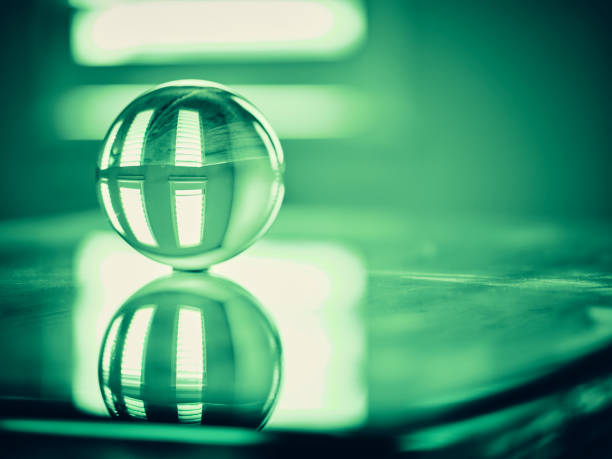 World globe crystal glass reflect on blue glossy table. Global business and economy. Environmental conservation or ecology concept