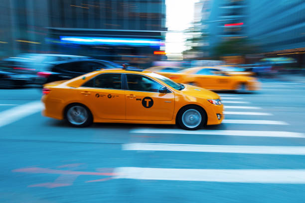 New York City, USA - October 07, 2015: yellow cab in Manhattan in motion blur. The taxicabs of New York City are widely recognized icons of the city