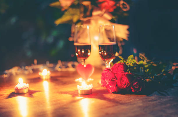 istock Valentines dinner romantic love concept Romantic table setting decorated with Red heart and couple champagne glass roses flower with candlelight 1088831336
