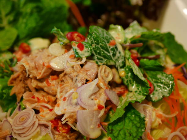 istock Salad with shrimp and tomato in plate on light board 1088834856