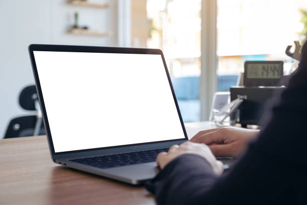 istock Mockup image of hands using and typing on laptop with blank white desktop screen 1088835060