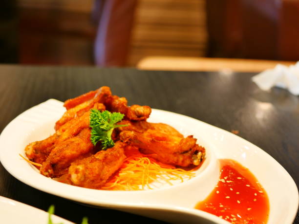 istock Close-up of fried chicken wings sprinkle 1088835200