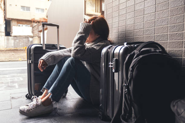istock A woman sitting with feeling sad and lost while traveling 1088835380