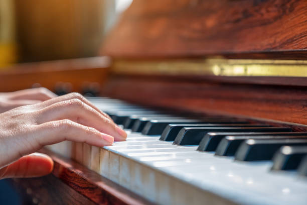 istock Closeup image of hands playing a piano 1088835524
