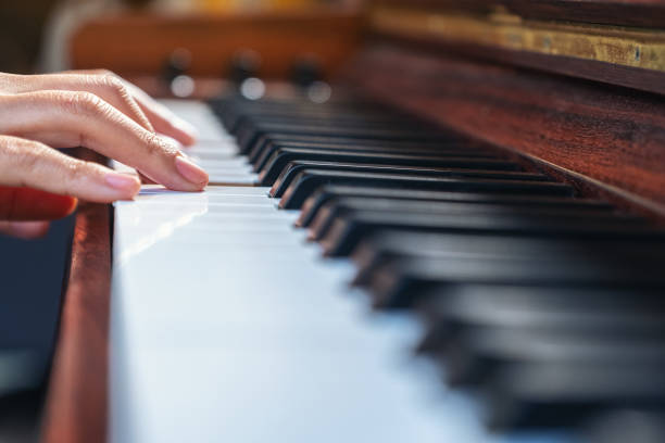 istock Closeup image of hands playing a piano 1088835538