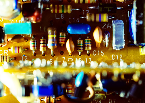 Taking a close look at a vintage circuit board.