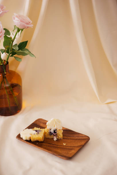 istock Female hands cut the delicious cupcakes on table 1088860184