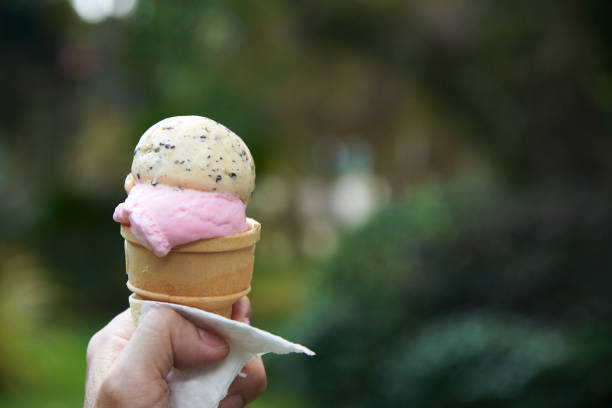 istock A hand holding a tasty melting ice cream cone 1088860600
