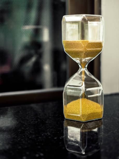 istock Modern hexagon hourglass with golden sand seed 1088864964