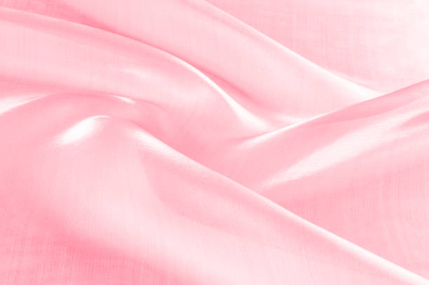 istock Background texture, pattern. Cloth pink silk. Smooth elegant pink silk or satin can use as wedding background. Luxurious valentine day background design. 1088865330