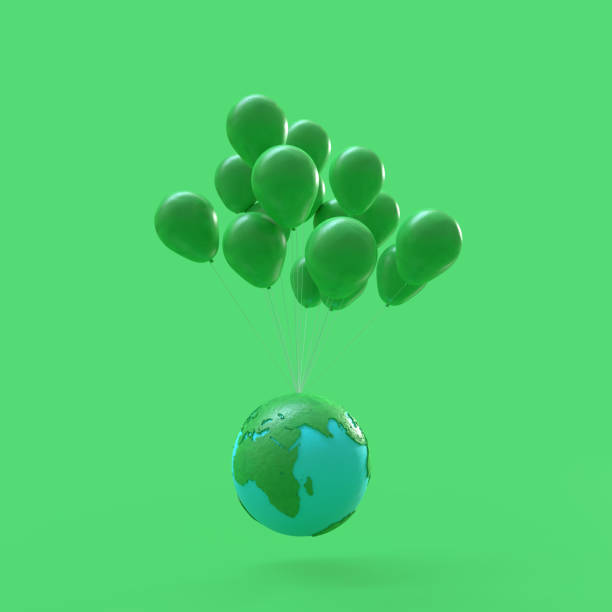 最小限のアイデア コンセプト。緑の風船を持つ浮動地球 - three dimensional shape continents bright blue ストックフォトと画像