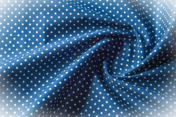 istock Texture background pattern. Silk fabric, blue cloth in white peas. On a black background. Flower textile or fabric. Texture of fabric. Fabric, textiles, fabric, material, woven. 1088866894