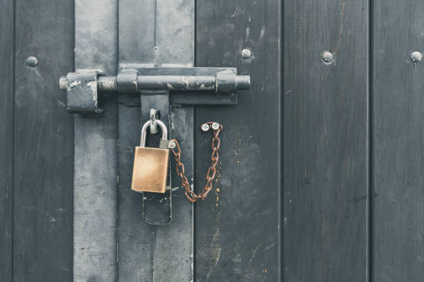istock Copper lock on a dark grey weathered background 1088868466