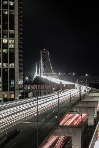 istock Bay Bridge at Night from above freeway with traffic, speeding light trails in San Francisco 1088868476