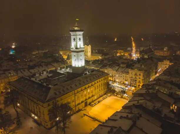 Photo of aerial view of capital building in center of european city at sunset in winter time