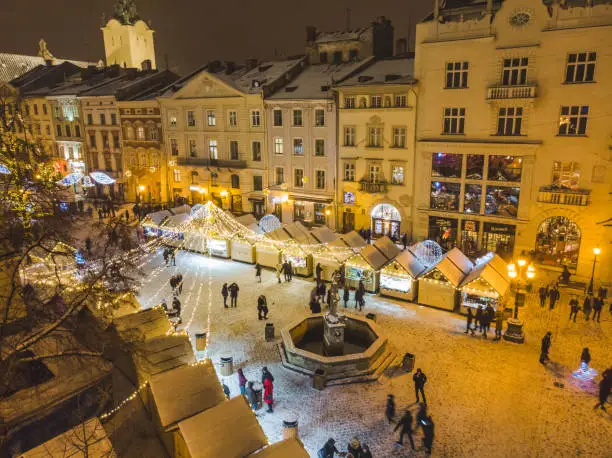 Photo of LVIV, UKRAINE - December 15, 2018: aerial view on christmas fest at square of old european city