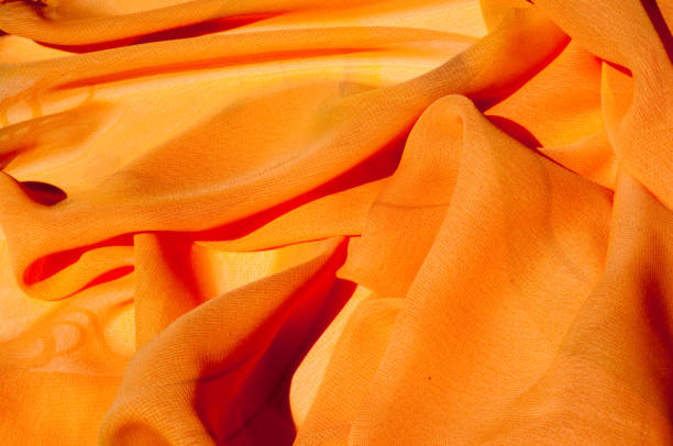 Background texture pattern. Silk crepe of chiffon peach peachpuff Introducing the sultry and stunning  Silk Satin you see here. Duchess satin is a gorgeous high-fiber count medium-bodied low luster