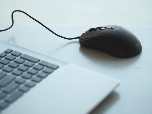 istock closeup one Notebook and mouse on the desk working 1088874176