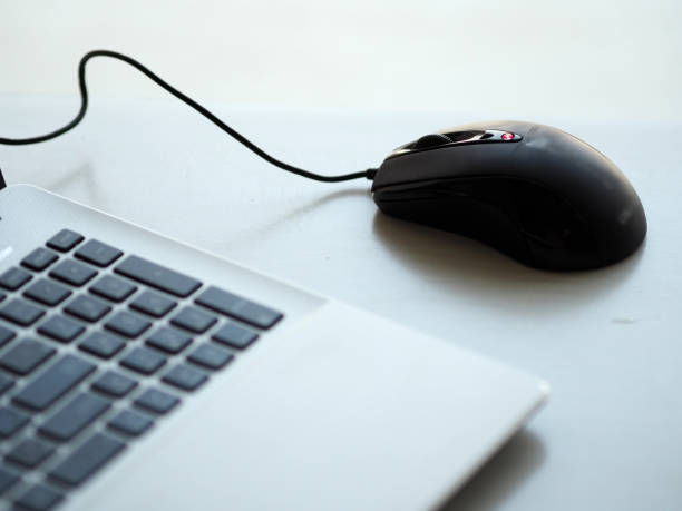 istock closeup one Notebook and mouse on the desk working 1088874280