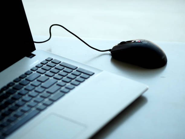 istock closeup one Notebook and mouse on the desk working 1088874342