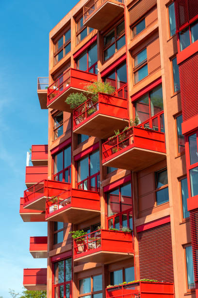 istock Modern red apartment house with many balconies 1088875786