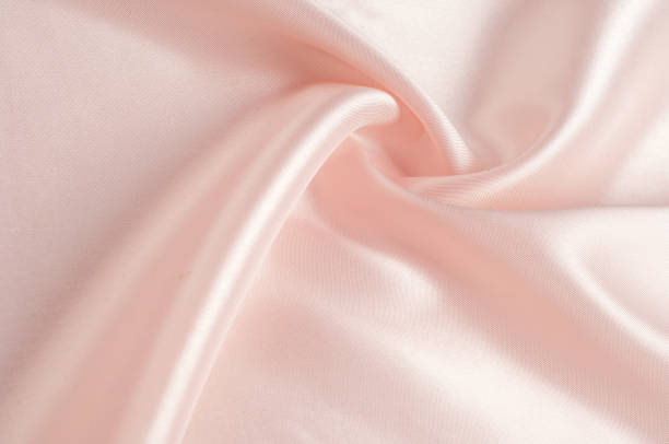 istock Texture, background, pattern. Fabric silk pink background. Beautiful pink satin. Drapery background. winds waves, creating a beautiful background of the folds. 1088876084