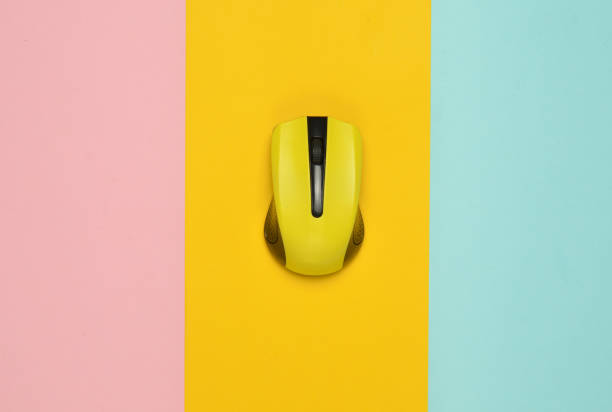 istock Wireless mouse pc on a multi-colored paper background, minimalism, top view 1088880630