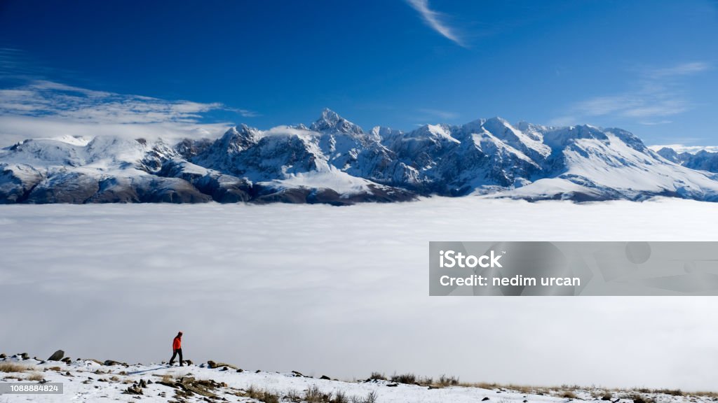 mountains and fog peaks rising above cloudspeaks rising above clouds Beauty In Nature Stock Photo