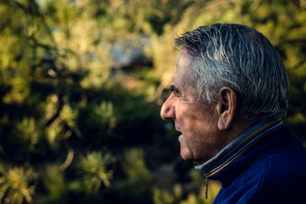 istock Attractive senior man with gray hair looking in foreground 1088886316