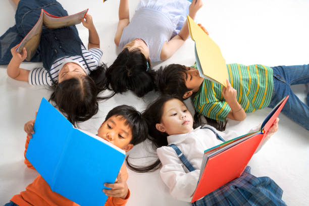 Asian Little Children Reading Book Cheerful