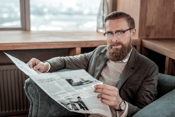 istock Attractive young businessman looking straight at camera 1088891084