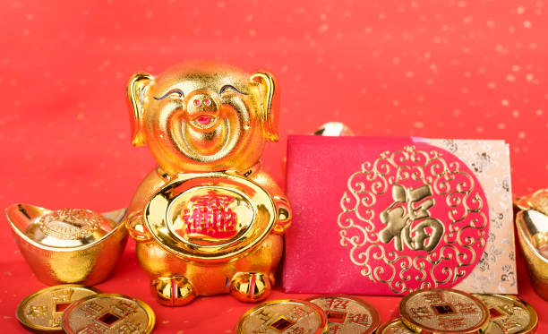 istock Golden pig statue on red background 1088912098