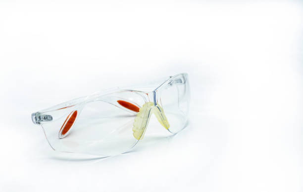 istock Plastic safety glasses isolated on white background. Goggles for protective eye of worker at construction site or in factory. Safety and security tools in work place. Protective eye glasses use in lab 1088912252