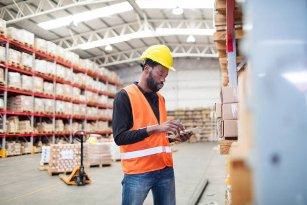 istock Mature warehouse worker with checklist taking stock 1088912270