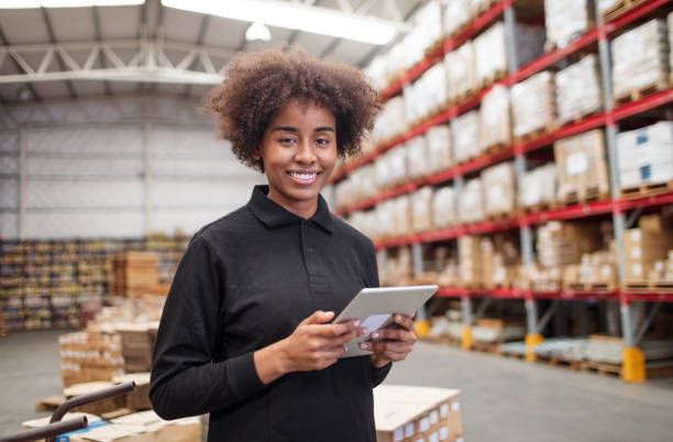 istock Woman working in large distribution warehouse 1088912342