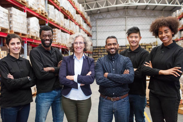 istock Female manager with logistics team in distribution warehouse 1088912360