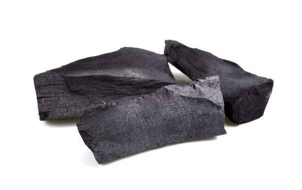 istock pile black coal isolated on white background 1088918654
