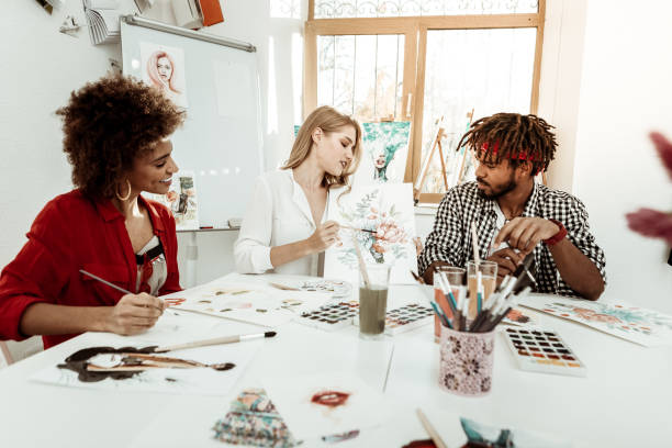 Three young but promising artists working in one studio together