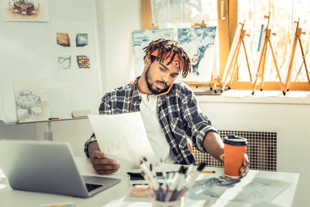 istock Interior designer feeling extremely busy speaking by phone 1088920826