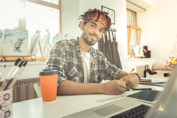 istock Young dark-eyed art student feeling joyful studying all day long 1088920922