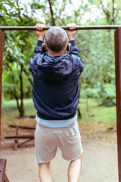 istock Mid Aged Man Exercising in Public Park 1088927006