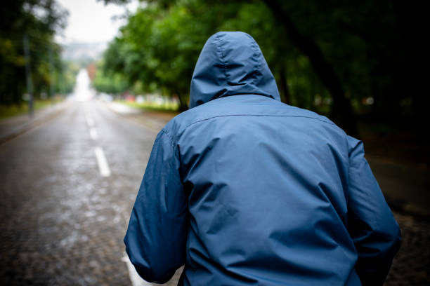 istock Man Jogging on a Rainy Day in the Park 1088928448