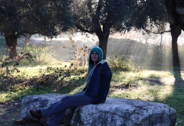 Girl Sitting on a Stone-2