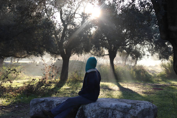 istock Girl Sitting on a Stone-1 1088929628