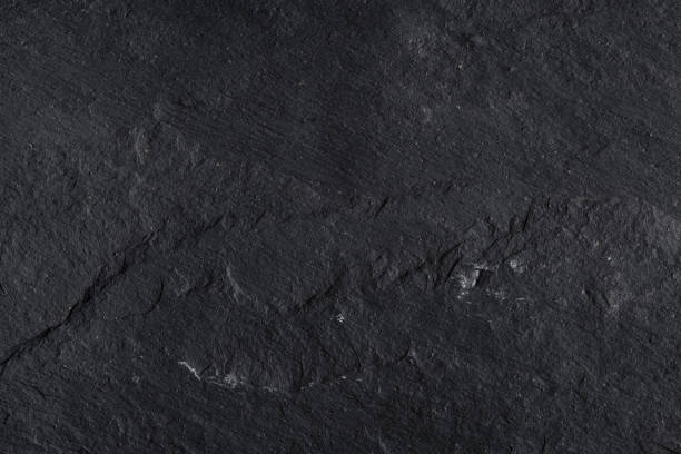 istock Dark gray black slate background or texture of natural stone. 1088929720