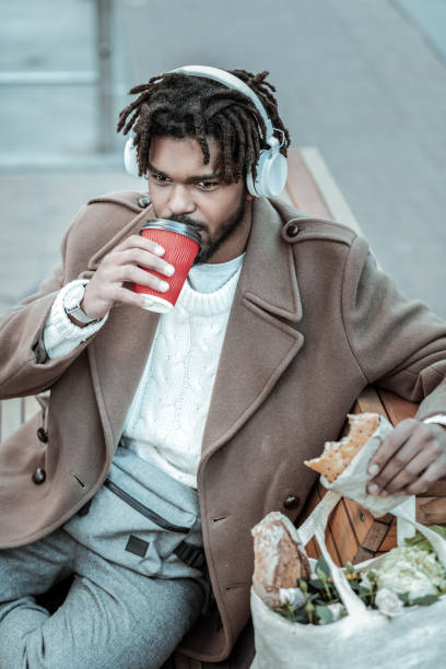 istock Relaxed young international man drinking hot coffee 1088933480