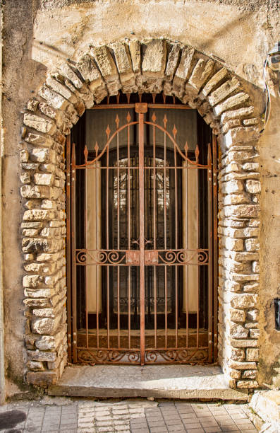 istock Medieval iron door, adorned with stone 1088935788