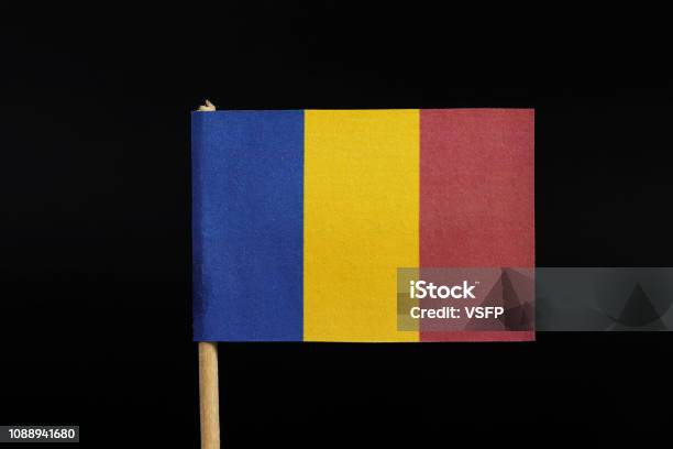 A National Flag Of Romania On Toothpick On Black Background A Vertical Tricolor Of Blue Yellow And Red Stock Photo - Download Image Now