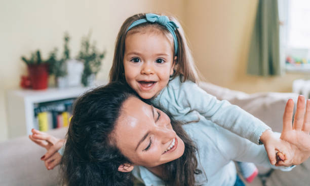 istock Mom and daughter playing 1088944618