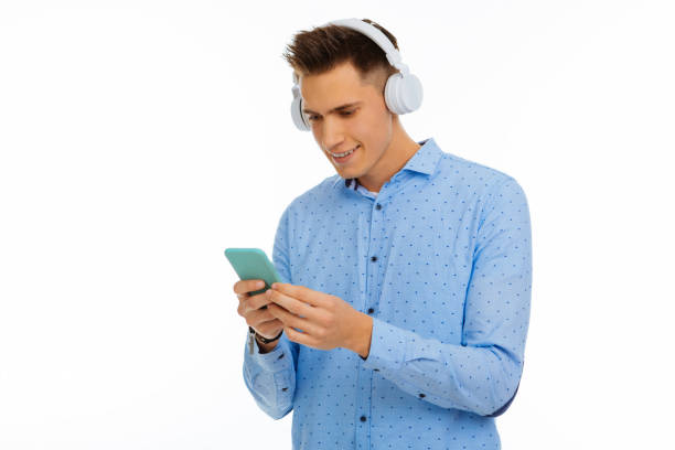 istock Delighted nice man looking at the smartphone screen 1088947088
